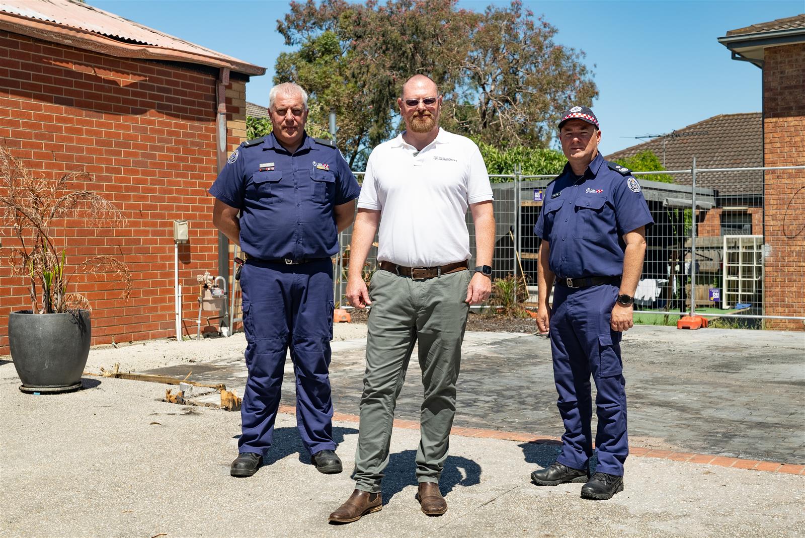 Langwarrin Captain Sean Curtin, property owner Jamie Universita, CFA Deputy Chief Officer Trevor Owen